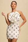 POLKA DOT WHITE AND BLACK MINI SUMMER DRESS WITH A FLOWER AND OPEN BACK