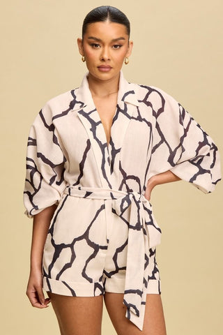 WHITE JUMPSUIT WITH A BELT