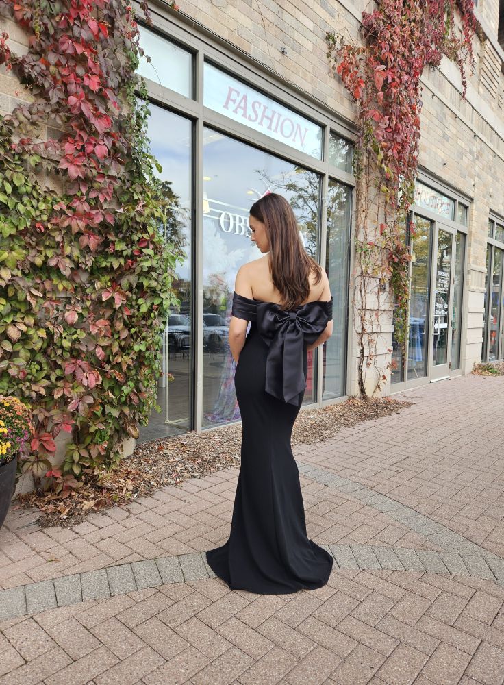 BLACK LONG OFF THE SHOULDER GOWN WITH A BOW PIN