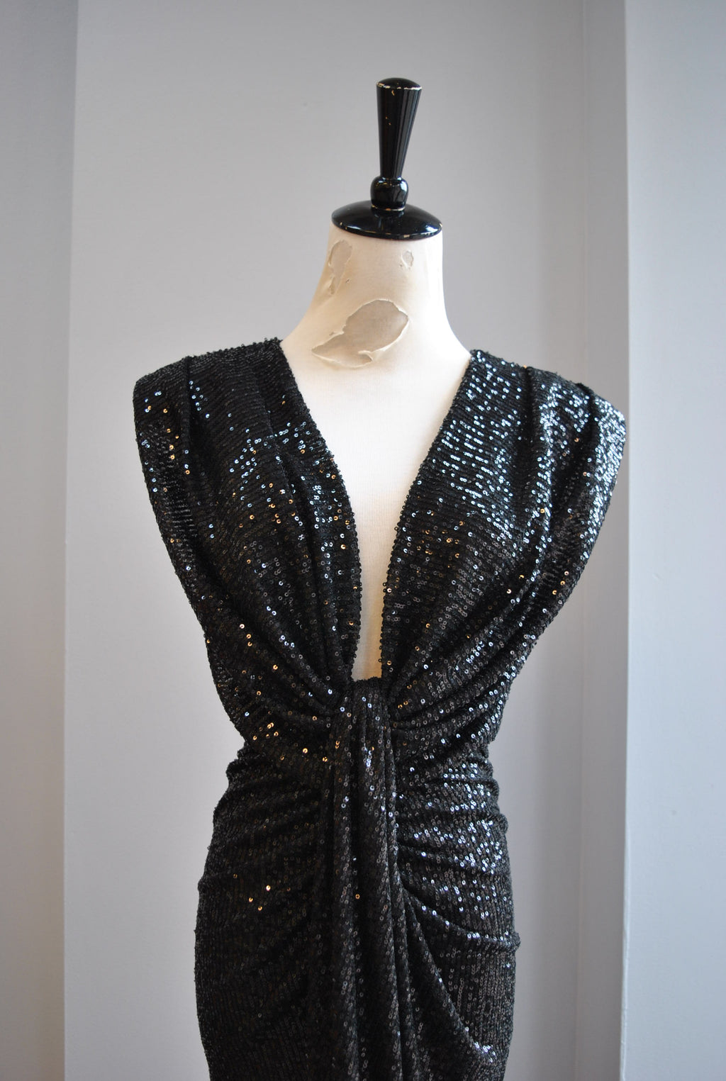 BLACK SEQUIN MIDI DRESS WITH STATEMENT SHOULDER AND FRONT RUSHING