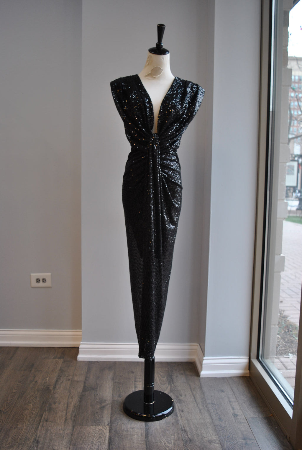 BLACK SEQUIN MIDI DRESS WITH STATEMENT SHOULDER AND FRONT RUSHING