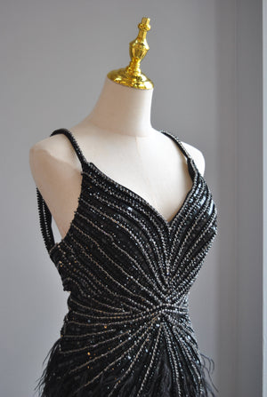 BLACK EVENING GOWN WITH FEATHERS AND RHINESTONES