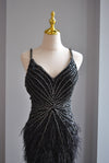BLACK EVENING GOWN WITH FEATHERS AND RHINESTONES