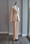 BEIGE SUIT WITH A SIDE CUT OUT AND CHAINS