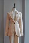BEIGE SUIT WITH A SIDE CUT OUT AND CHAINS