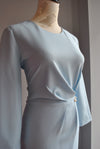 LIGHT BLUE MIDI DRESS WITH SIDE PIN AND RUSHING