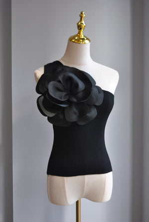 BLACK ASYMMETRIC TOP WITH A FLOWER