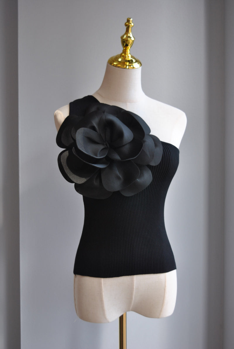 BLACK ASYMMETRIC TOP WITH A FLOWER