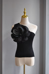 BLACK ASYMMETRIC TOP WITH A FLOWER