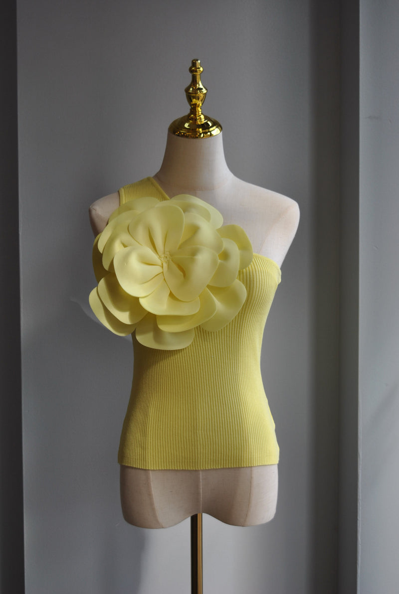 YELLOW ASYMMETRIC TOP WITH A FLOWER