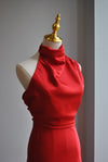 RED SILKY MIDI DRESS WITH HALTER TOP AND ASYMMETRIC OPEN BACK