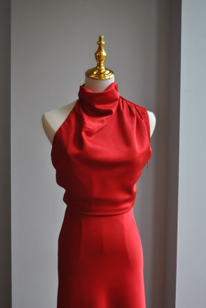 RED SILKY MIDI DRESS WITH HALTER TOP AND ASYMMETRIC OPEN BACK