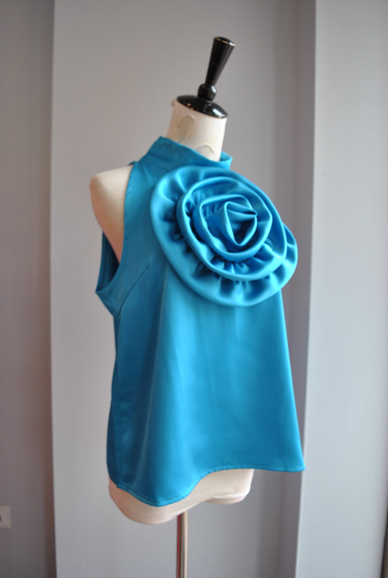BLUE HALTER STYLE TOP WITH A FLOWER