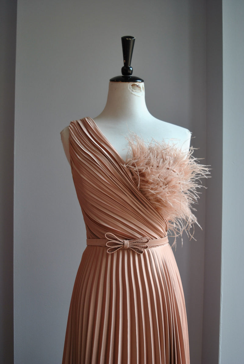 ROSE GOLD PLEATED EVENING GOWN WITH FEATHERS