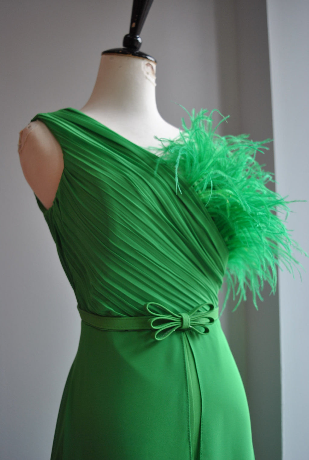 GREEN JUMPSUIT WITH FEATHERS