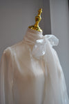 SHEER WHITE BLOUSE WITH STATEMENT SLEEVES AND TIE NECK