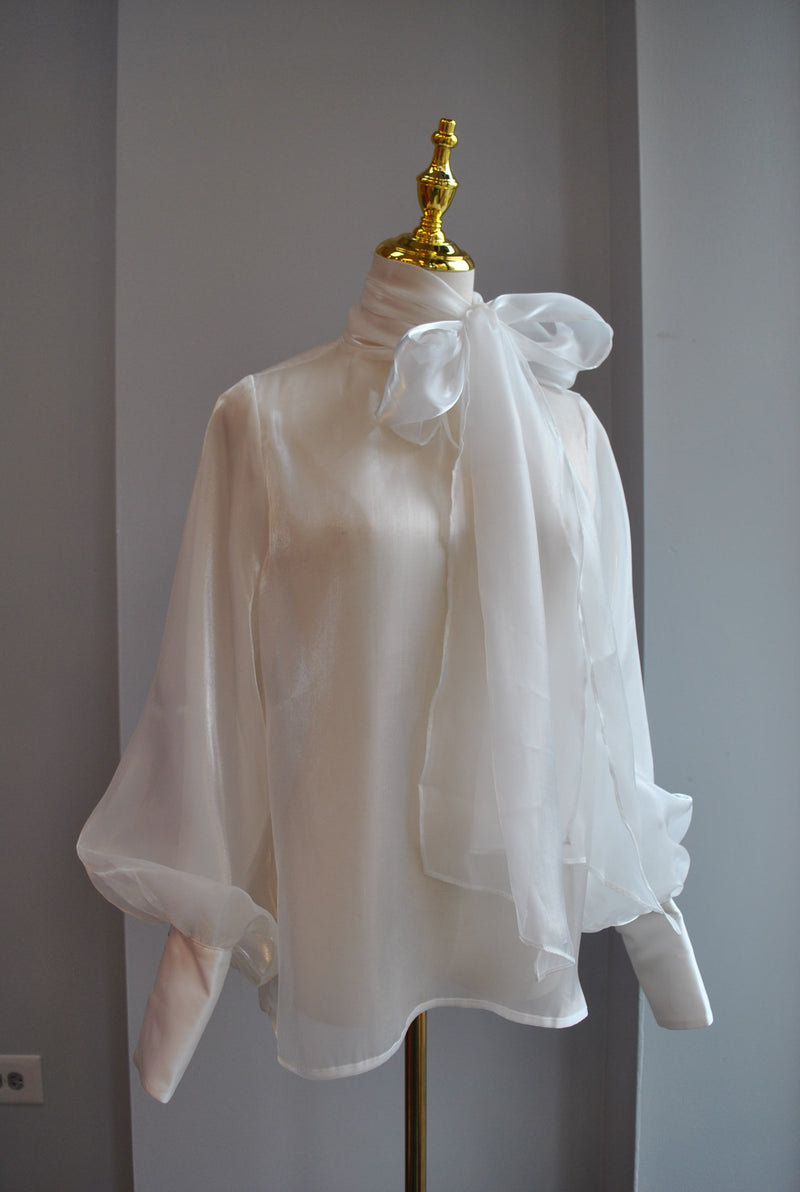 SHEER WHITE BLOUSE WITH STATEMENT SLEEVES AND TIE NECK