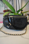 BLACK GUILTED HANDBAG WITH CUTOFF  HANDLE AND GOLD CHAIN