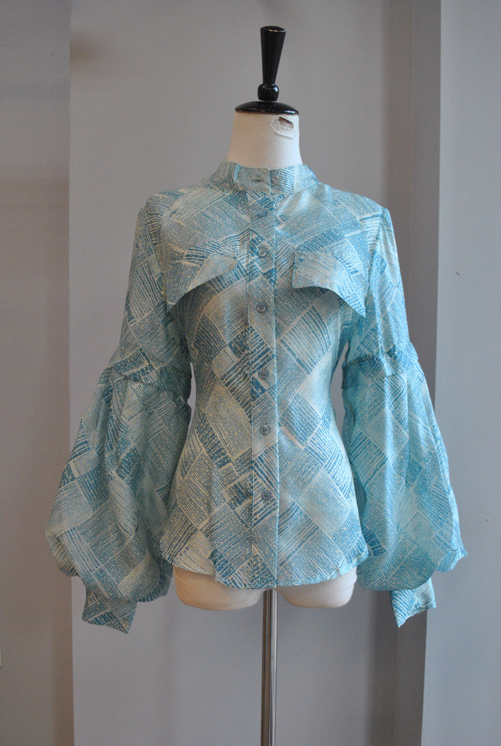 CLEARANCE - LIGHT BLUE TOP WITH STATEMENT SLEEVES