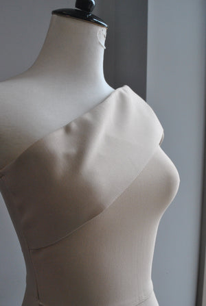CLEARANCE - BEIGE ASYMMETRIC MIDI BANDAGE DRESS