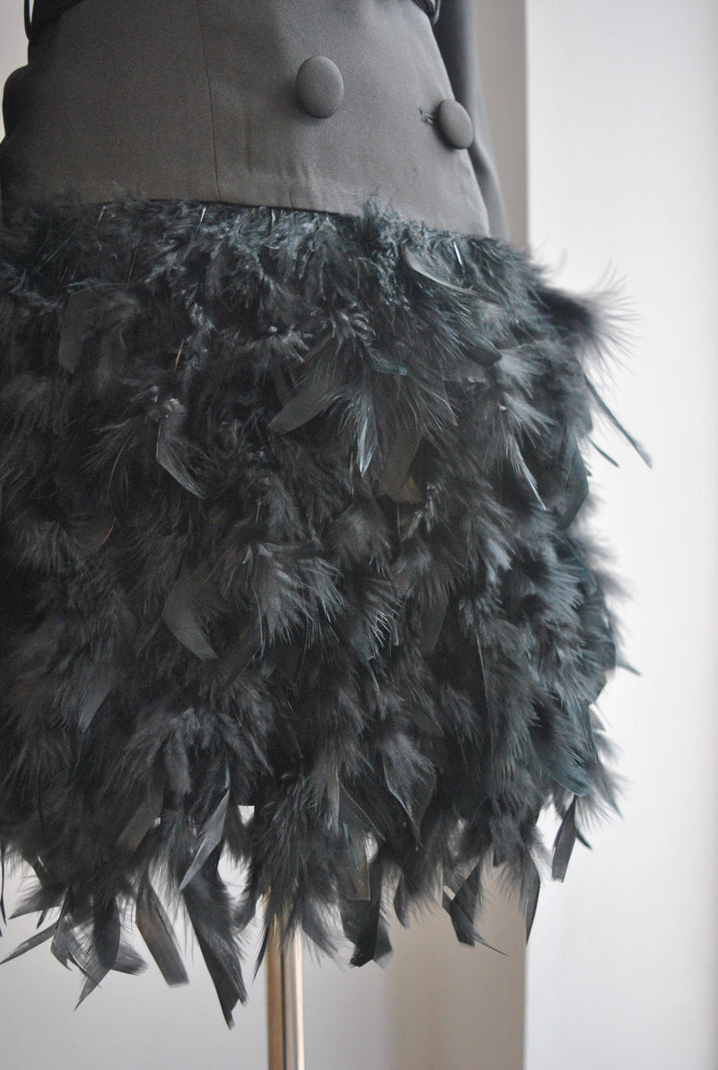 BLACK JACKET DRESS WITH A CRYSTAL BELT AND FEATHERS