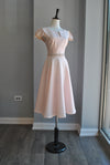 LIGHT PINK FIT AND FLAIR MIDI DRESS WITH SIDE POCKETS