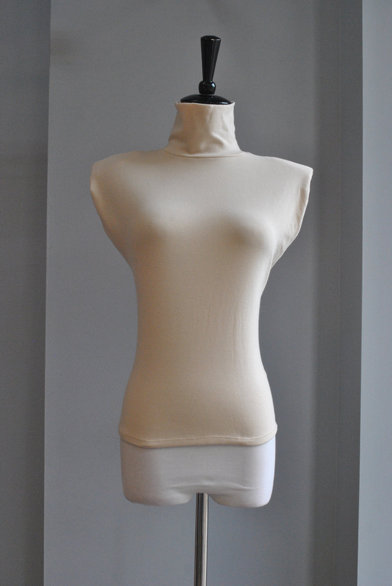 LIGHT CREAM TOP WITH HIGH NECK AND PADDED SHOULDERS
