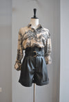 BLACK FAUX LEATHER HIGH WAISTED SHORTS WITH A BELT AND SIDE POCKETS