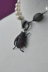 WHITE FRESHWATER PEARL NECKLACE WITH LADYBUG