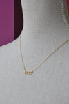 GOLD CHOKER STYLE NECKLACE WITH "BOSS" CHARM
