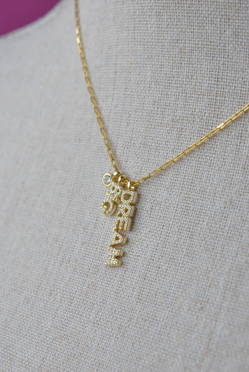 GOLD DELICATE NECKLACE WITH A "DREAM BIG" PENDANT