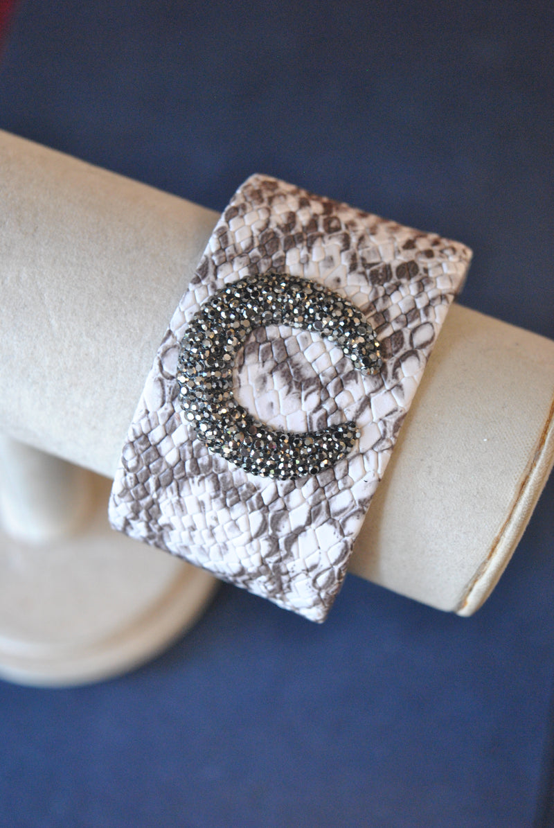 HITE AND TAUPE ECO LEATHER CUFF WITH CRYSTALS