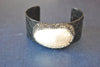 BLACK ECO LEATHER CUFF WITH WHITE SHELL AND SWAROVSKI CRYSTALS