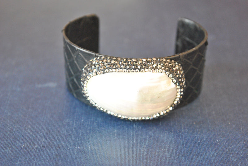 BLACK ECO LEATHER CUFF WITH WHITE SHELL AND SWAROVSKI CRYSTALS