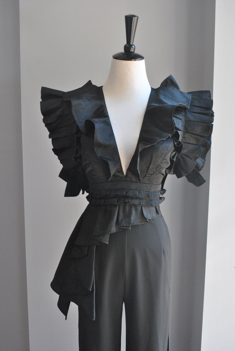 BLACK JUMPSUIT WITH STATEMENT RUFFLE SLEEVES